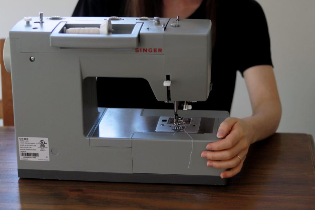 woman sitting behind sewing machine