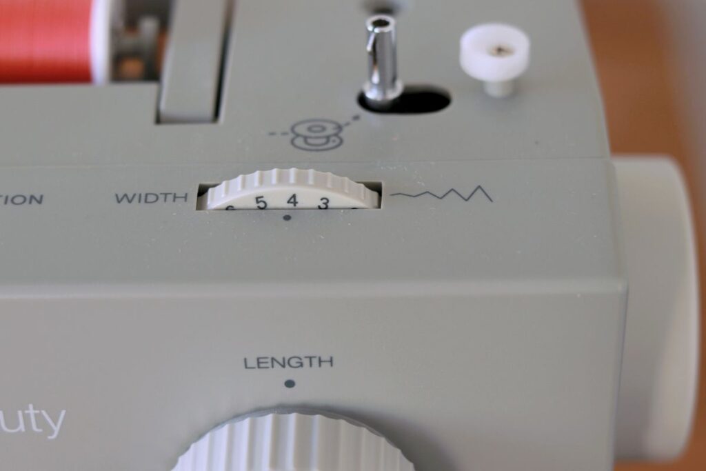 sewing machine stitch width dial