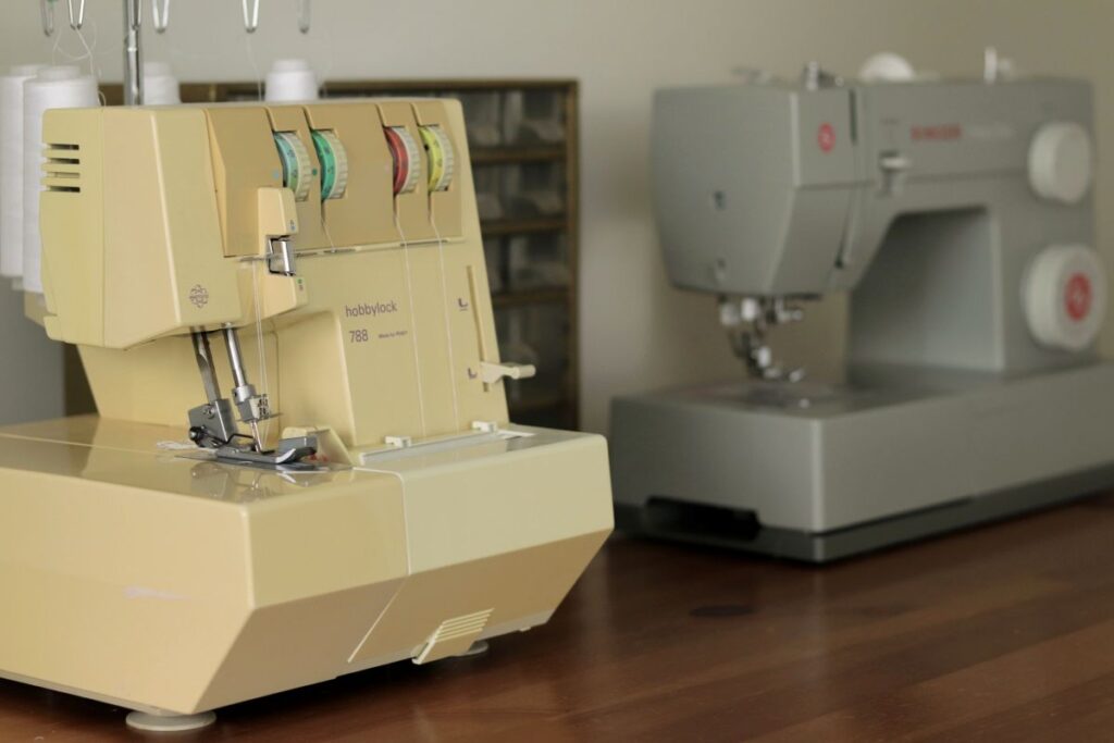 serger and sewing machine on table