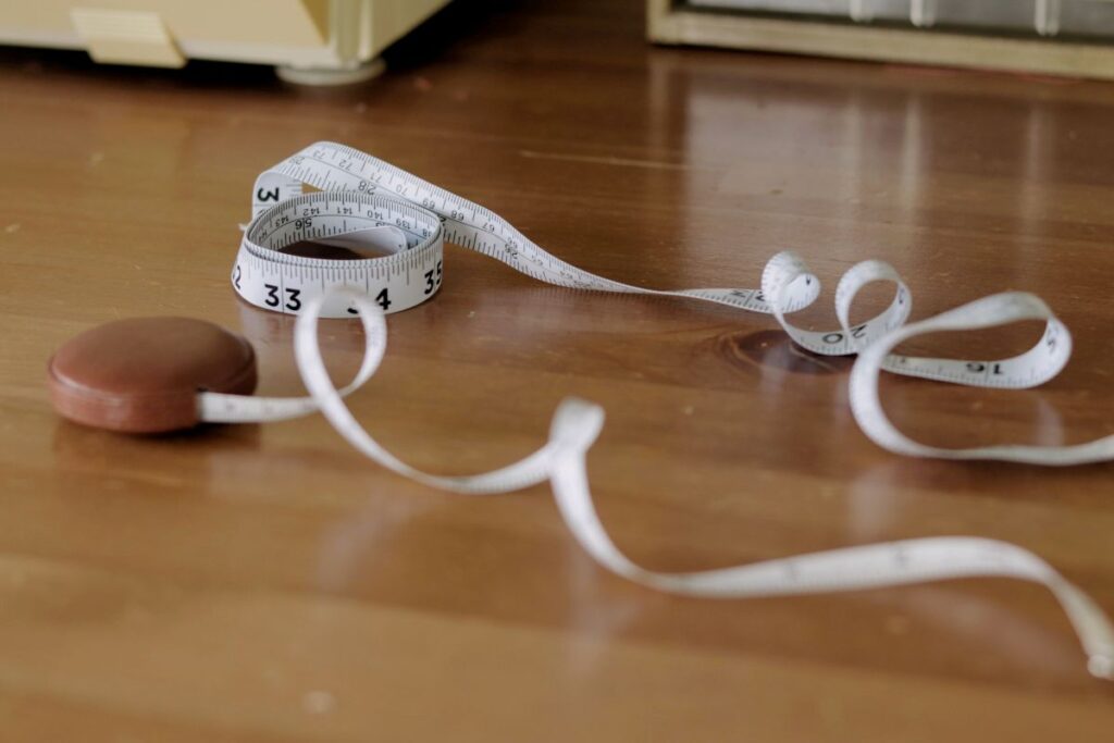 two measuring tapes on table