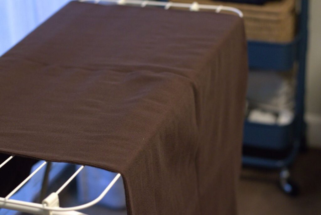 fabric hanging over drying rack